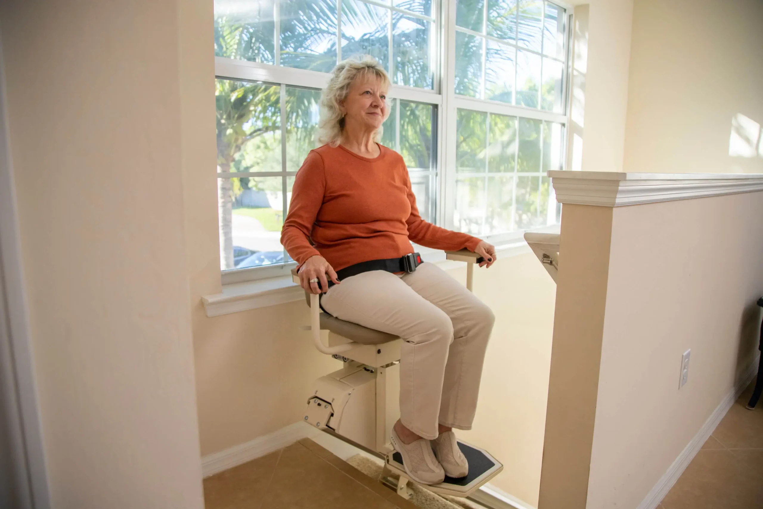Pinnacle-SL600HD-User-Seated-in-Chair-Lift-scaled